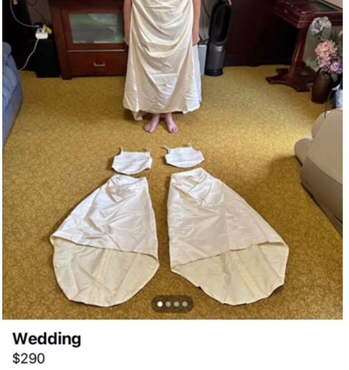 Person wearing a poorly crafted wedding dress with two separate, unfinished fabric pieces on a yellow carpet floor.