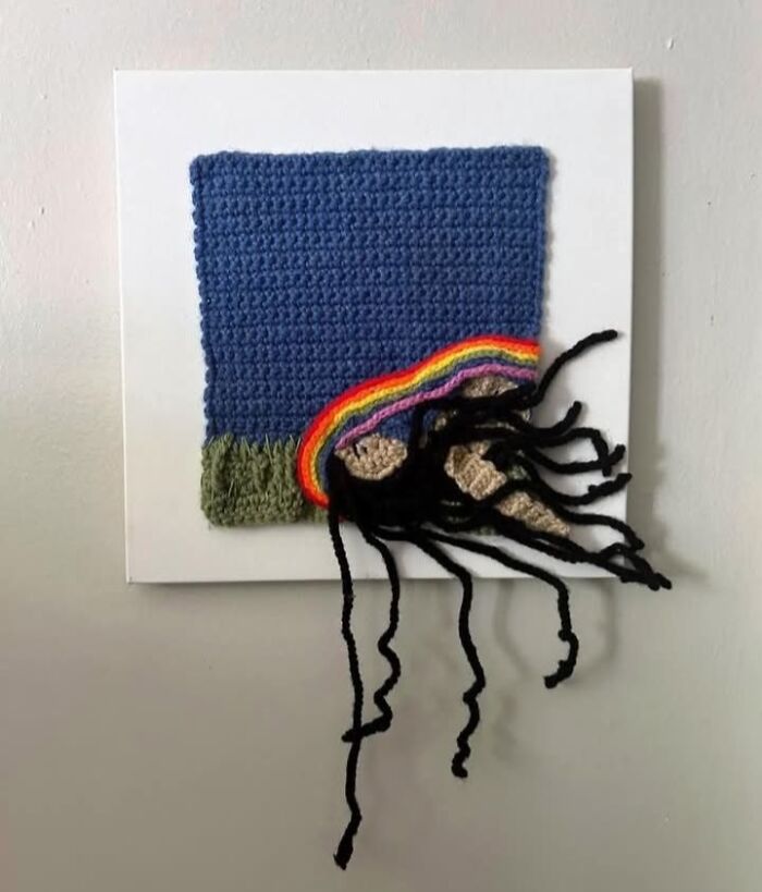 Crocheted artwork with a distorted figure and rainbow detail showcasing unusual and questionable crafts by netizens.
