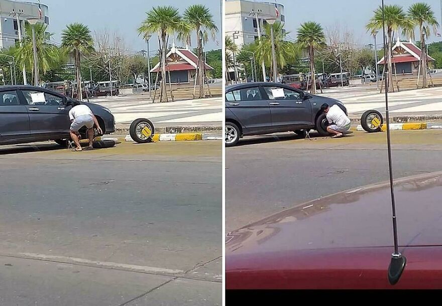 Hombre cambiando una llanta en la calle, mostrando una escena que parece de un futuro en el a&ntilde;o 3019.