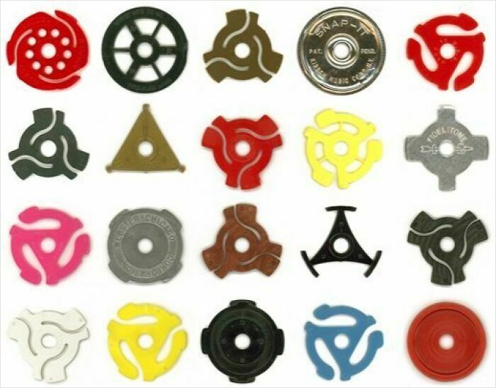 Collection of vintage record player adapters in various shapes and colors, showcasing unique and weird vintage things.