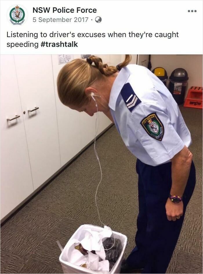 Police officer bending to listen to trash can with earphones, a funny post from official social media accounts.