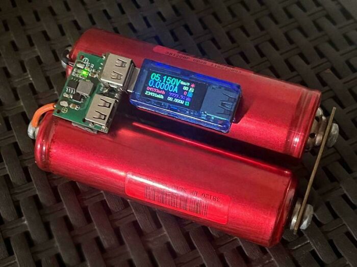 Battery pack with USB ports and voltage meter, showcasing redneck engineering and creative MacGyvering in a DIY project.