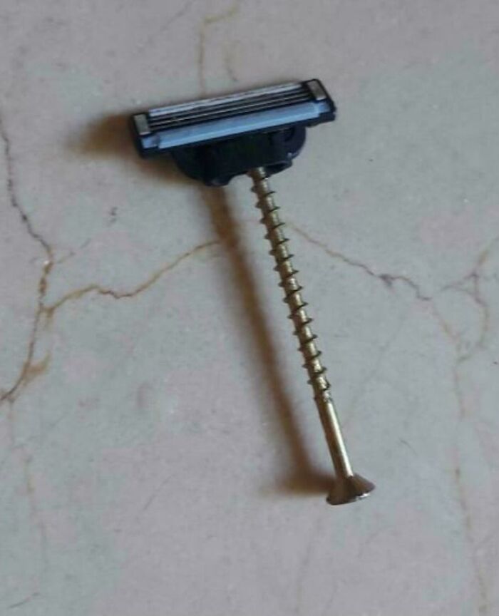 Razor head attached to a long s***w, an example of redneck engineering and creative MacGyvering.