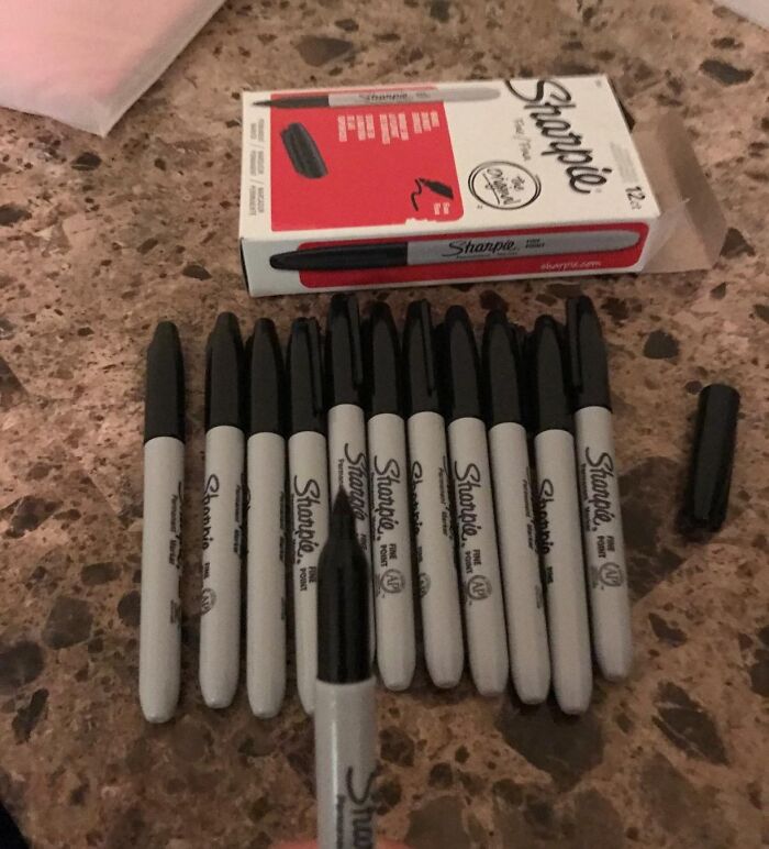 Pack of black Sharpie markers on a table, perfect for back-to-school deals and preparing syllabuses for students.