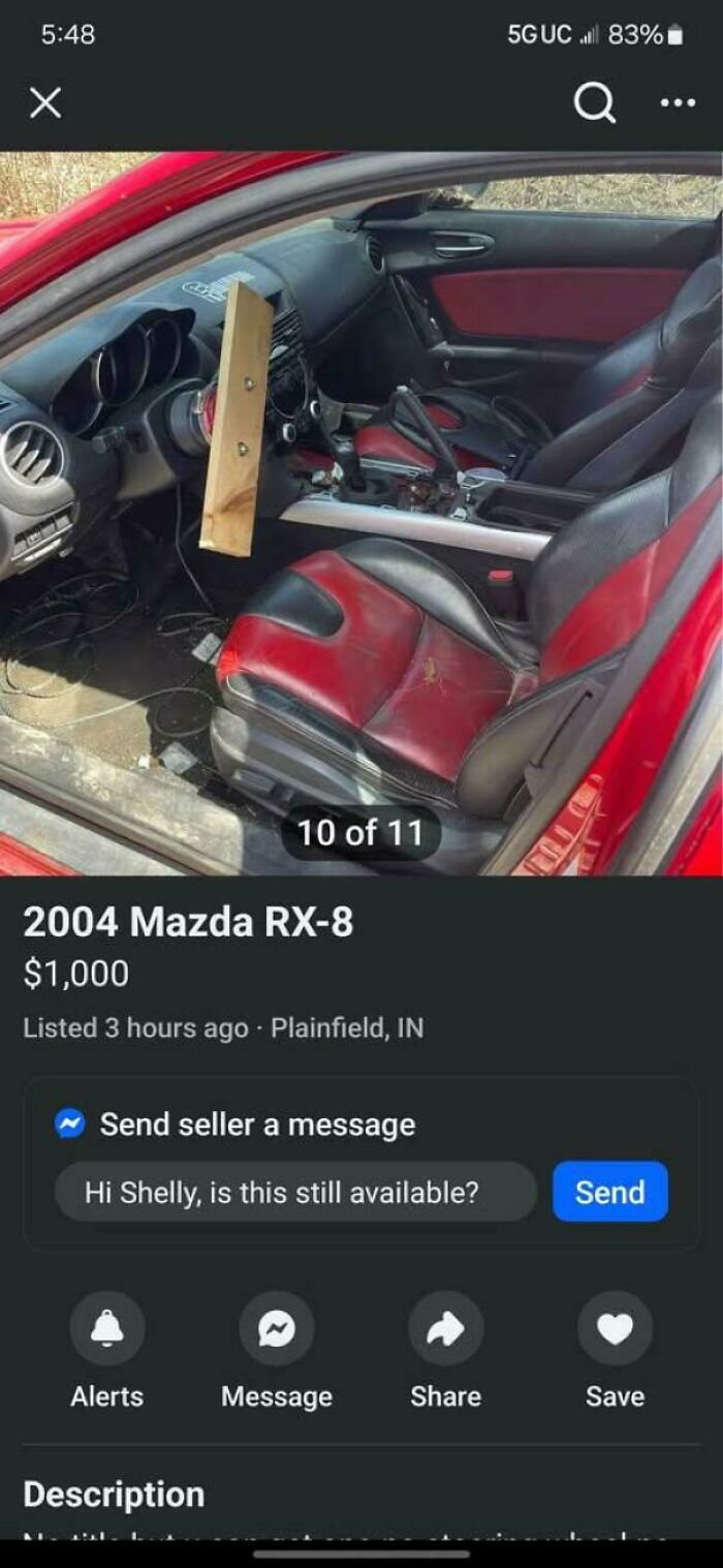 Redneck engineering shown with DIY wooden steering wheel fix inside a 2004 Mazda RX-8 vehicle interior.