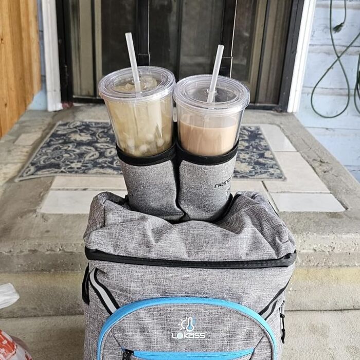 Gray insulated travel bag with two iced drinks in cup holders, perfect for travel essentials on a hot girl summer itinerary
