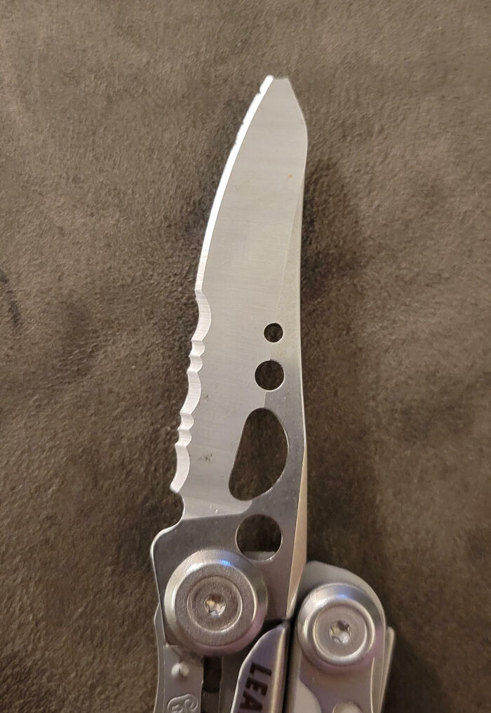 Close-up of a worn multitool knife blade showcasing an epic work fail from a manufacturing defect.