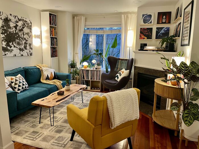 Cozy living space revamped with colorful furniture, plants, and modern decor showcasing creative living space renovation.