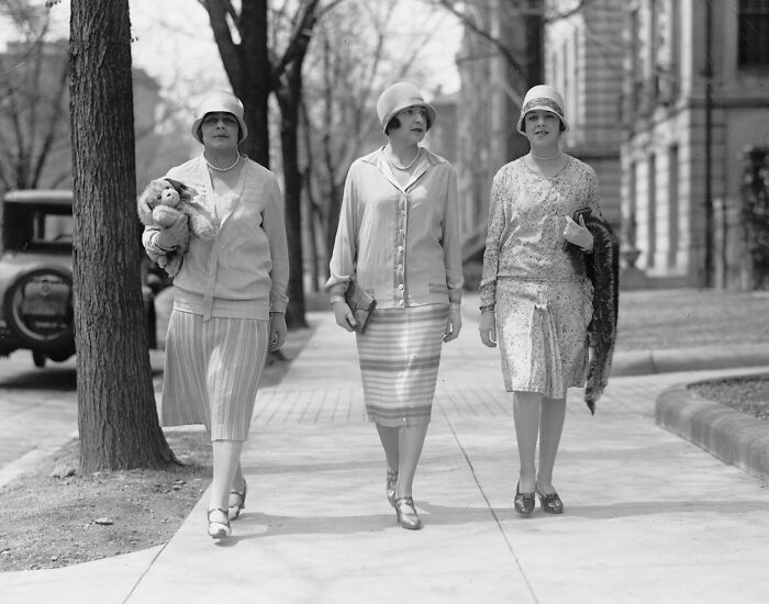 Three women in 1920s fashion walking on a sidewalk in Washington, D.C. vintage historical photo.