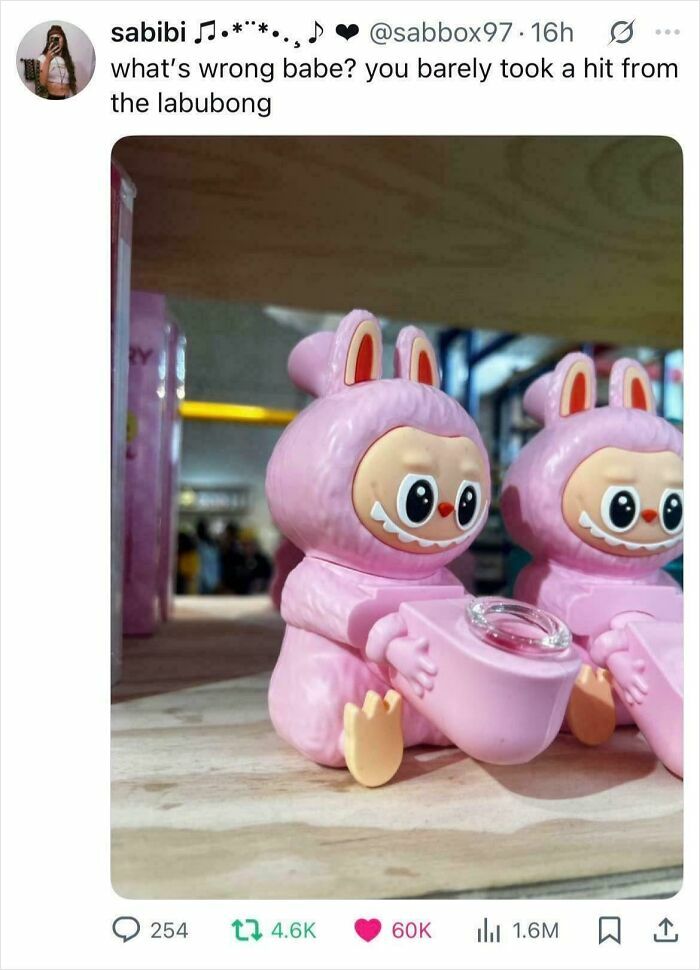 Labubu doll figure in pink bunny costume holding a pink object, sparking hilarious memes online.