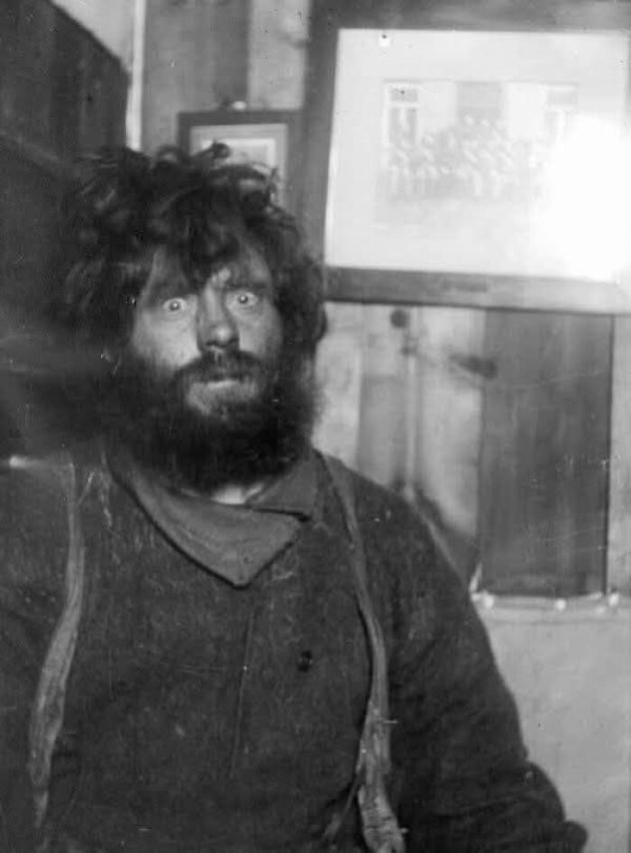 Black and white historical photo of a rugged man with wild hair and beard, illustrating fascinating historical photos.