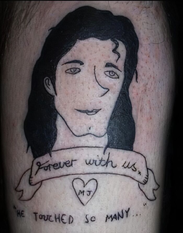 Tattoo of a poorly drawn portrait with the words forever with us and a heart, showcasing abysmally bad tattoos.