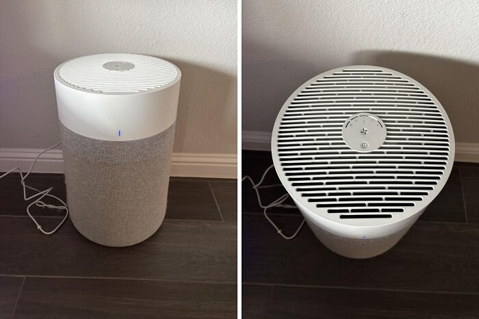 Modern air purifier on dark floor showcasing top and side views, featured in deals on brands you know and love.