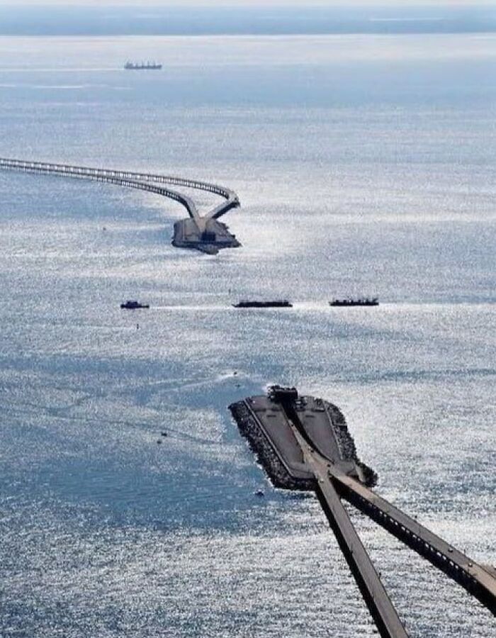 A long, winding bridge stretches over the ocean, showcasing the wonderful world of amazing engineering.