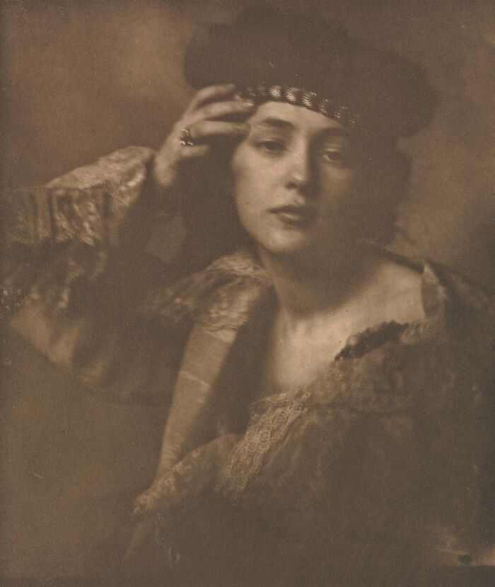 Vintage sepia photo of a woman from the 1900s showcasing the beauty of women in old photos.