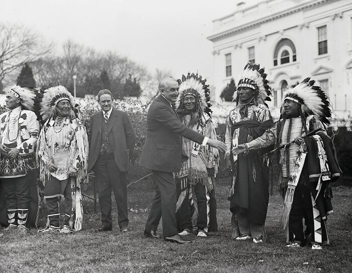 Vintage black and white photo of Native American chiefs with officials in Washington DC during the 1920s era.