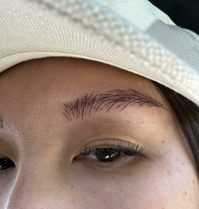 Close-up of a woman’s eyebrow after a salon glow-up but resulting in a surprising and disappointing beauty breakdown.