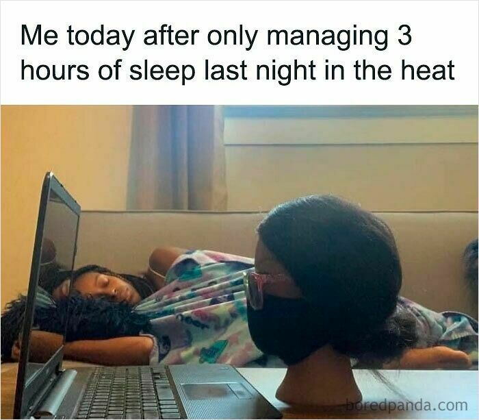 Person wearing a mask and glasses resting head on laptop with another person sleeping on a couch, reflecting funny WFH memes.