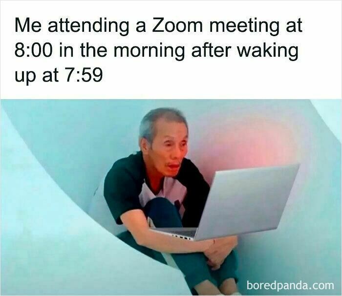 Man attending an early morning Zoom meeting, looking tired, illustrating funny WFH memes about working from home.