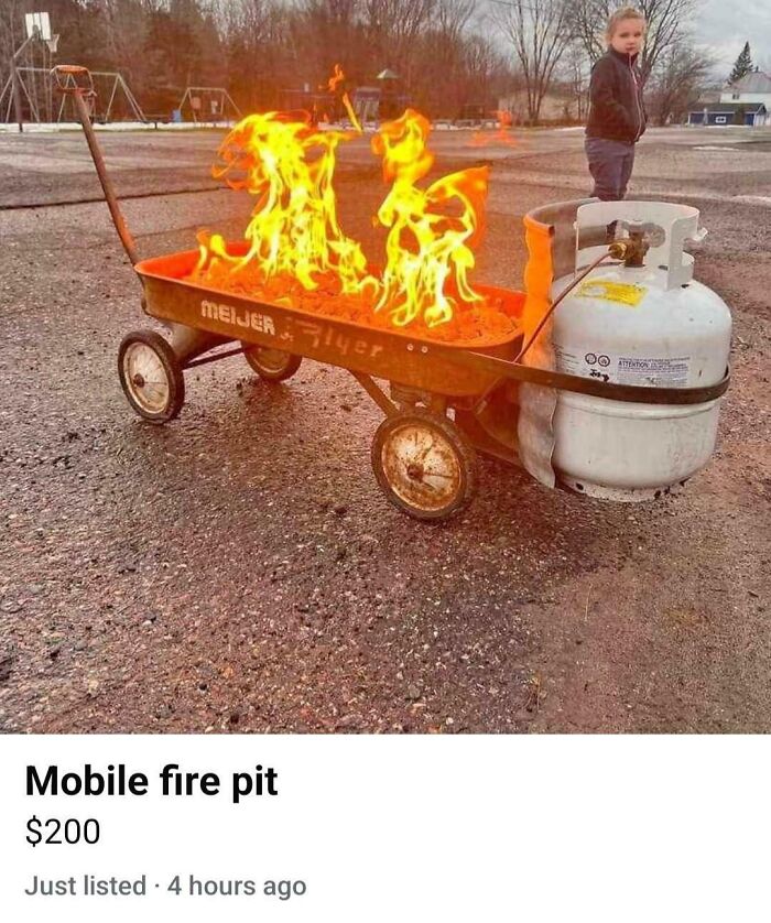 Mobile fire pit made from a red wagon with a propane tank, demonstrating creative redneck engineering outdoors.