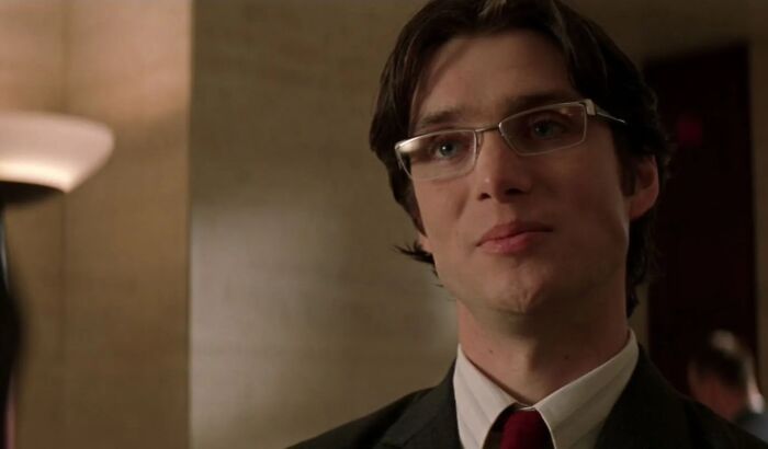 Young man wearing glasses and a suit, representing actors who auditioned for Heroes but became iconic villains instead.