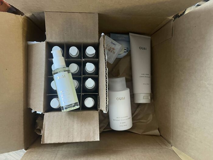Box filled with several bottles of Ouai hair care products, an example of people experiencing unbelievable luck.