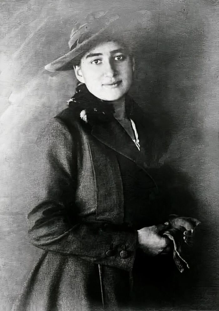 Black and white portrait of a woman in vintage clothing and hat, showcasing unique old photos with incredible stories.