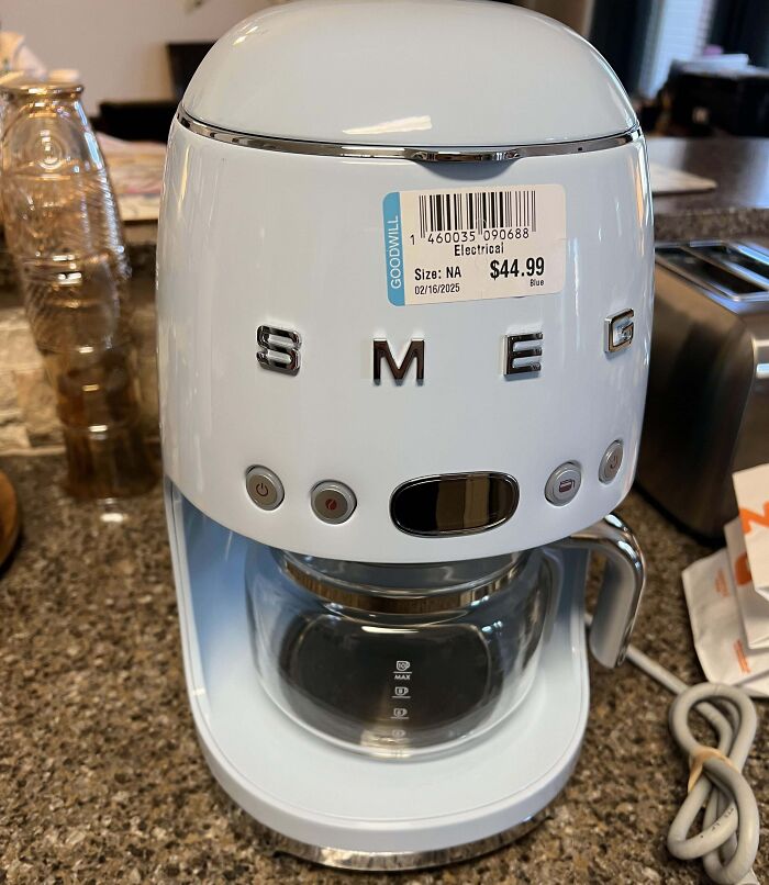 White SMEG coffee maker with a $44.99 price tag, showing unbelievable luck in finding a high-value appliance.