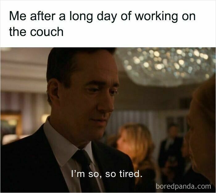 Man in a suit looking tired at a social event, illustrating the feeling of working from home without real pants.