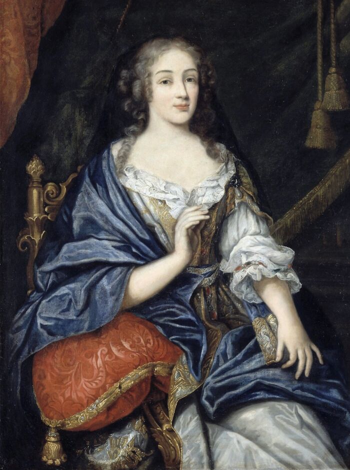 Portrait of a courtesan dressed in luxurious 17th-century clothing, symbolizing courtesans as power players in history.