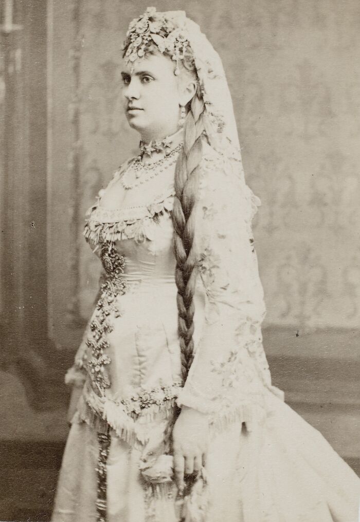 Vintage portrait of a courtesan dressed in ornate gown and jewelry, symbolizing courtesans as power players in history.