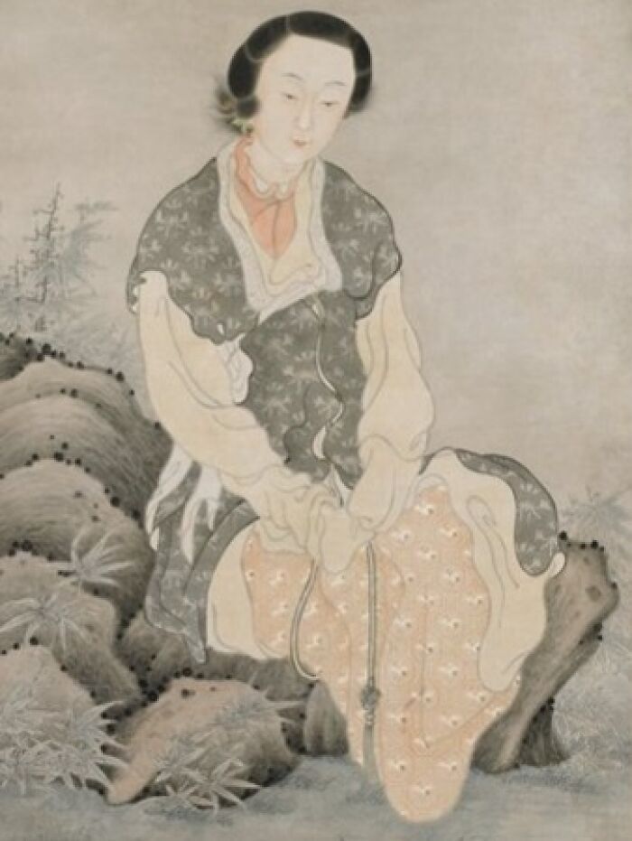 Painting of a historical courtesan sitting by rocks, illustrating courtesans as power players in history.
