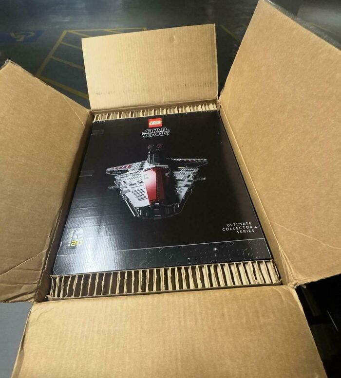 Open cardboard box containing a rare LEGO Star Wars set, showcasing amazing luck captured in the photo.