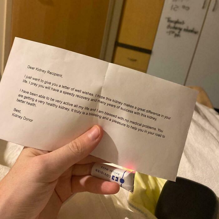 Hand holding a letter from a kidney donor expressing well wishes, a moment of unbelievable luck and hope.