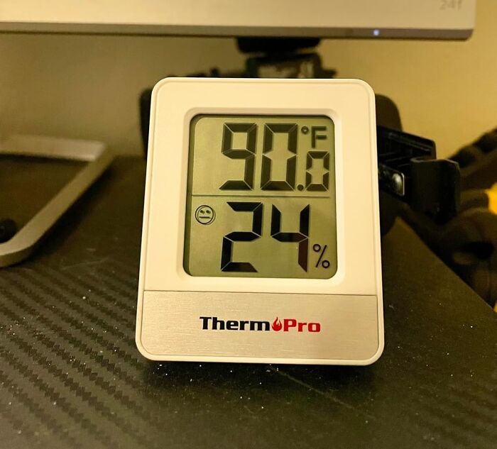 Digital thermometer showing 90 degrees Fahrenheit and 24 percent humidity, highlighting heatwave hacks for summer survival.
