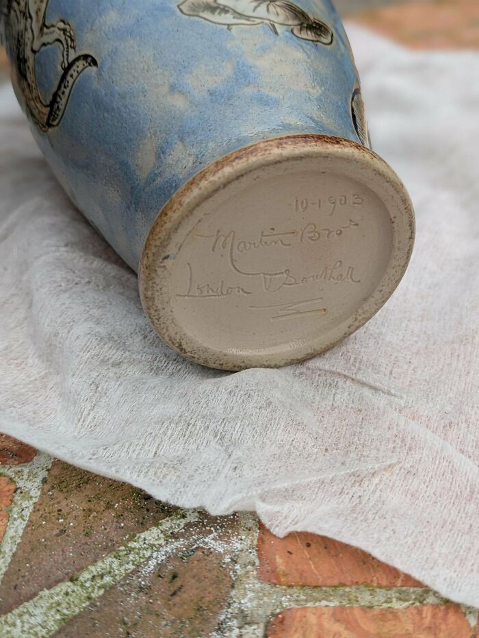 Bottom view of a beautiful old ceramic vase with dated markings, showcasing interesting antique craftsmanship details.