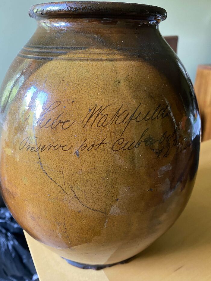Old vintage ceramic preserve pot with handwritten inscription, showcasing one of the most interesting and beautiful old things.