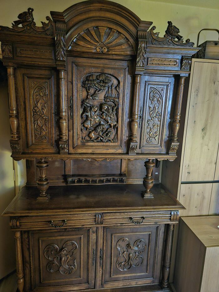 Intricately carved beautiful old wooden cabinet showcasing detailed artwork and classic design elements in a vintage style.