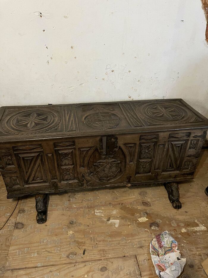 Antique wooden chest with intricate carvings and claw feet, showcasing beautiful old things people have the pleasure of owning.