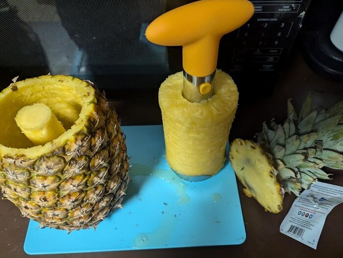 Pineapple corer tool removing fruit from the shell, demonstrating one of the random things that are surprisingly useful.