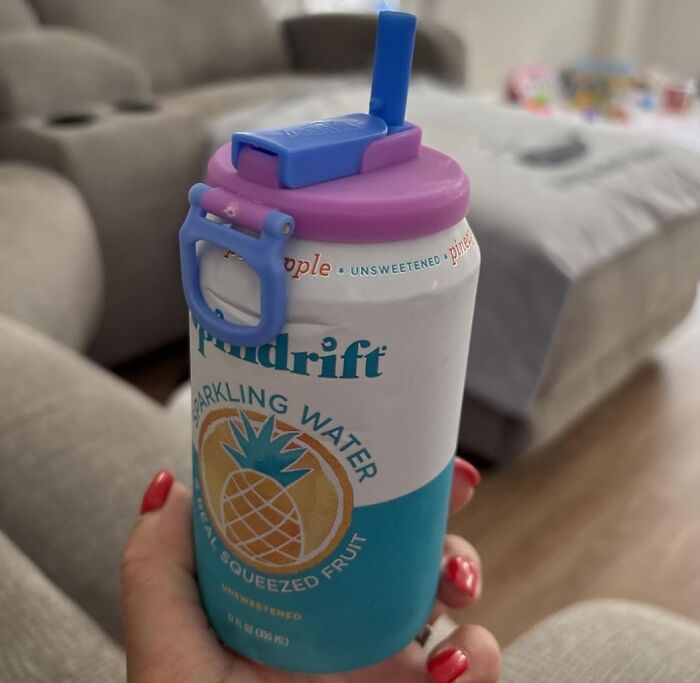 Reusable can lid with straw and handle, showing a creative random useful everyday item for convenience.