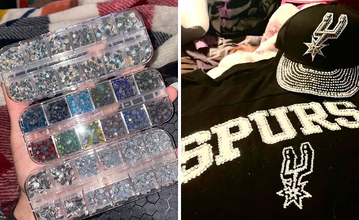 Various colorful rhinestones in plastic containers next to a black Spurs cap and shirt decorated with rhinestone designs.