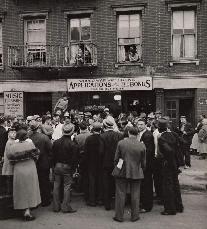 Crowd gathered outside a building during the Great Depression era, applying for World War veterans' bonus payments.