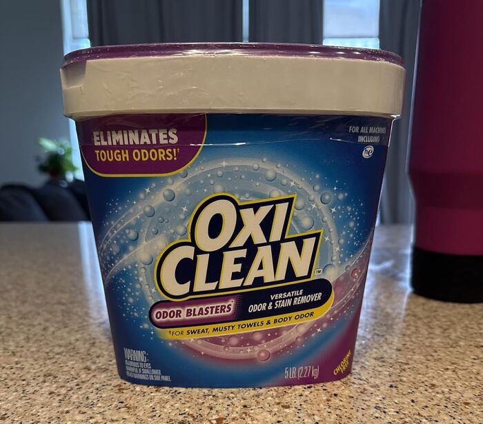 Oxi Clean odor blasters container on kitchen counter, a popular infomercial find for stain and odor removal.