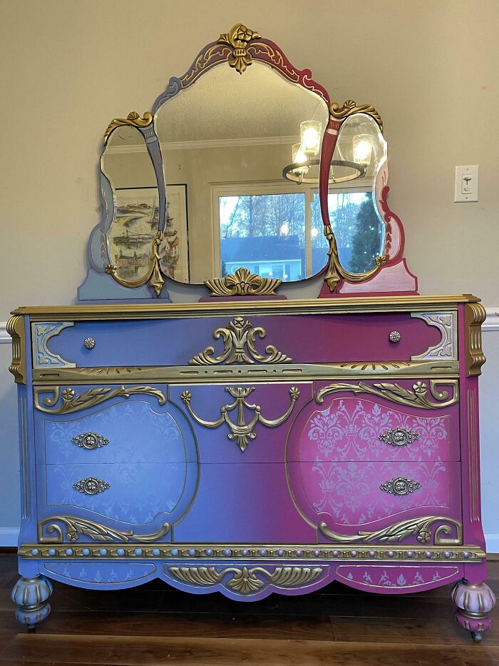 Vintage dresser with ornate gold details creatively flipped with blue and pink paint, showcasing furniture flipping pros skills.