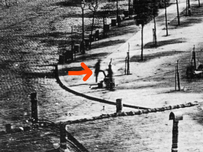 Black and white photo showing a shadow of a person appearing separated from their body, illustrating unusual and cool world facts.