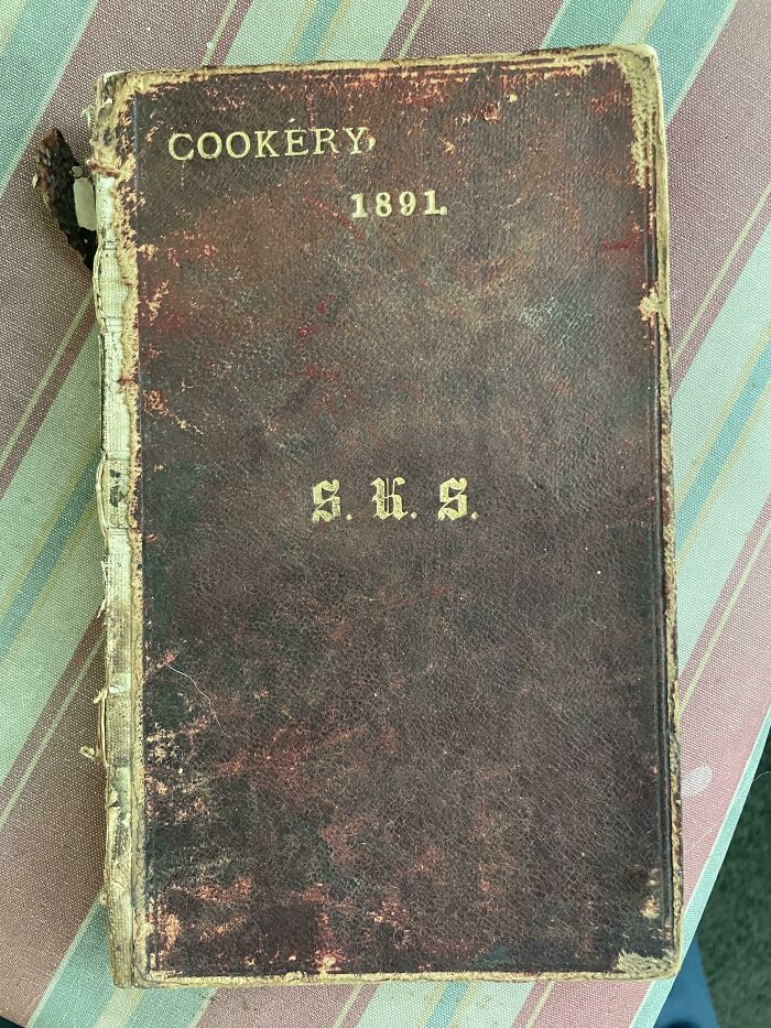 Worn 1891 cookery book found under floorboards in an old home revealing historic domestic life.