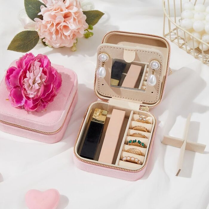 Pink jewelry organizer with rings, earrings, and perfume, perfect gifts that say planned this for weeks arriving quickly.