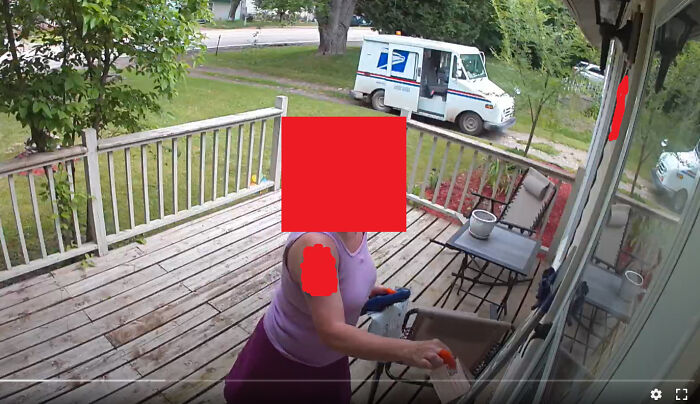 A postal delivery person dropping a package on a porch with a mail truck parked nearby, illustrating delivery mishaps.