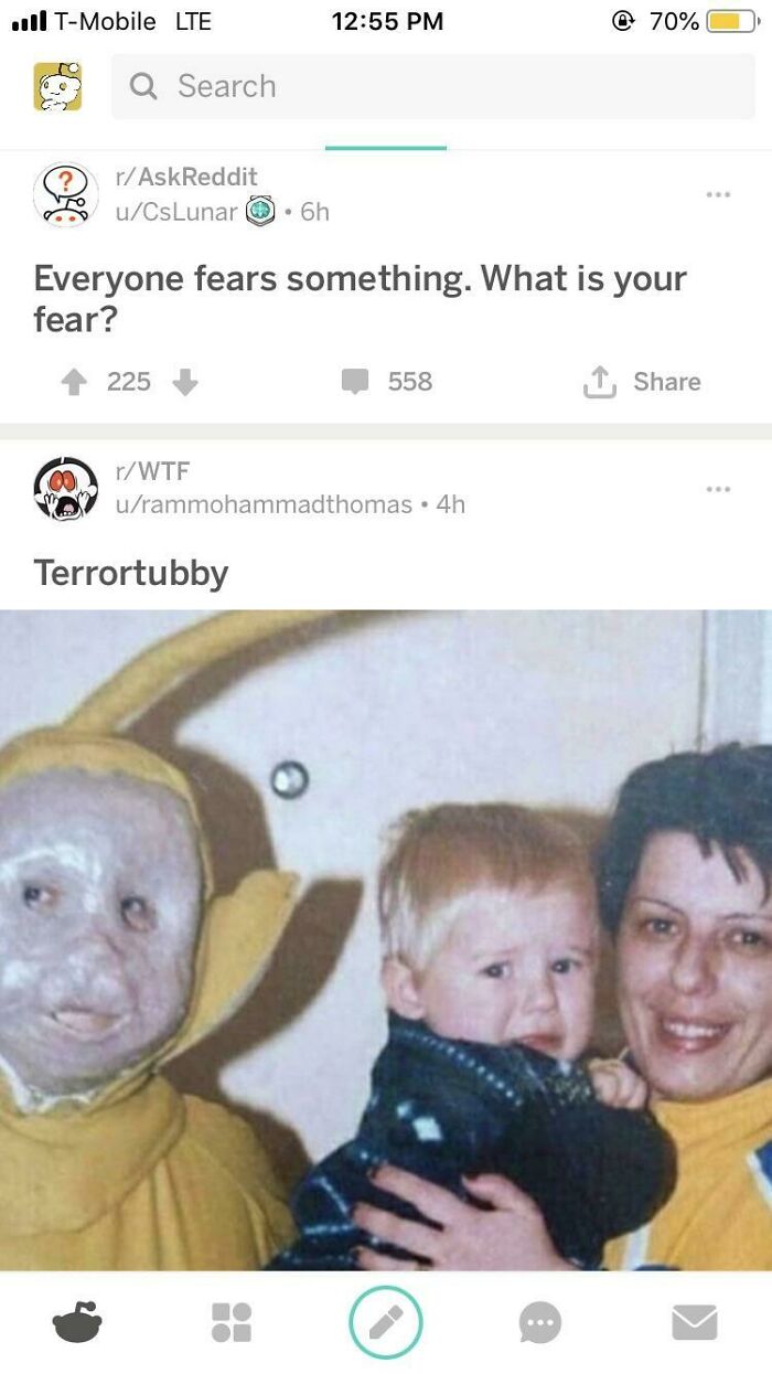 Screenshot of a weird internet moment showing a creepy Teletubby costume scaring a child and an adult smiling nearby.